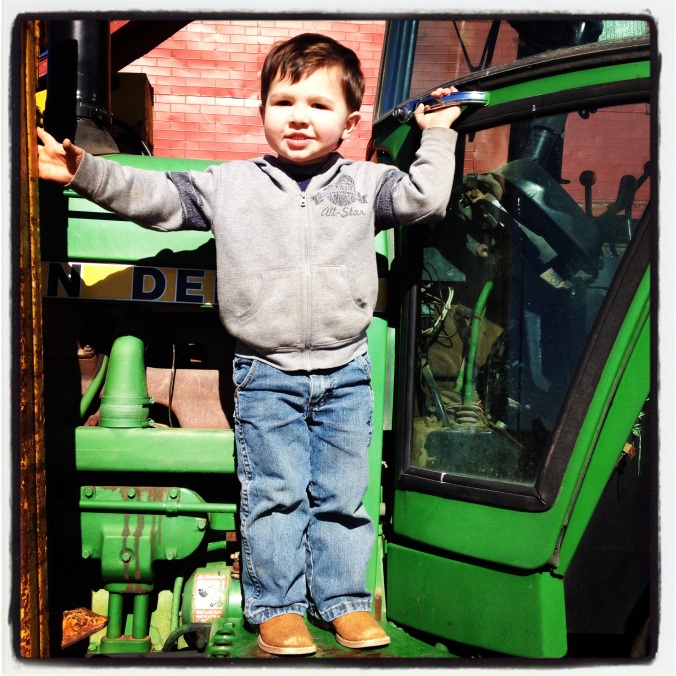 Shaun's favorite place in the whole world - the Scott family farm on the tractor.